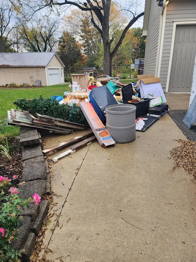 Dumpster being loaded with debris for Residential Dumpster Rental in Hood River